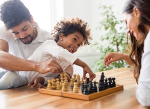 Family Playing Chess Cropped